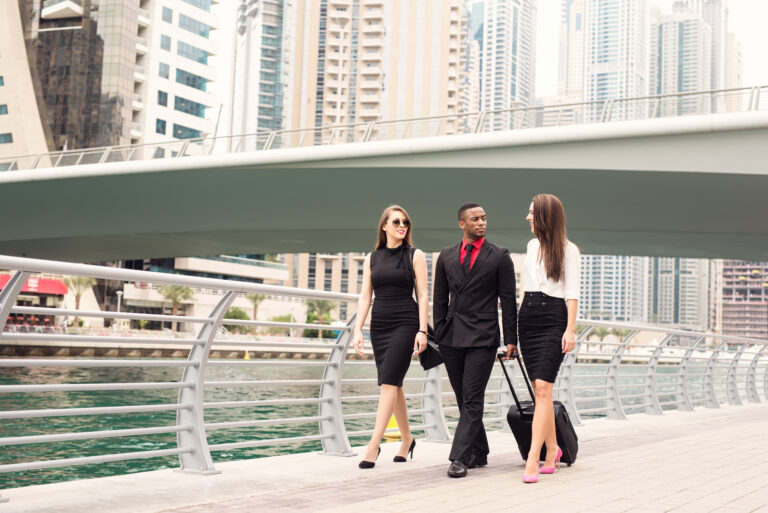 Business people walking at Dubai Marina.