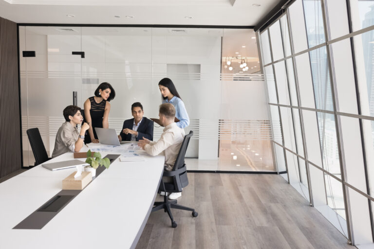 Five diverse teammates solve business-related matters during briefing