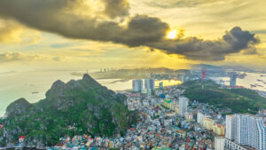 Aerial view of Ha Long city and rock island, Halong Bay, Vietnam, Southeast Asia. UNESCO World Heritage Site. Junk boat cruise to Ha Long Bay. Popular landmark, famous destination of Vietnam