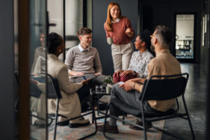 Group of Professionals Having a Positive Discussion in a Modern Office Space