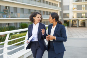 Focused female professionals discussing project