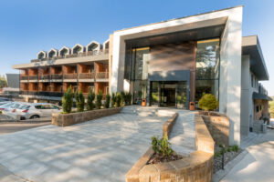 Entrance to a mountain hotel in the summer