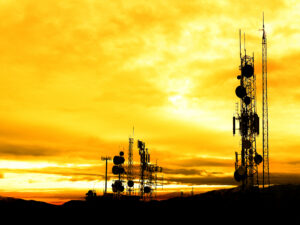 Radio Towers Broadcasting TV Internet and Communications with Sunrise or Sunset