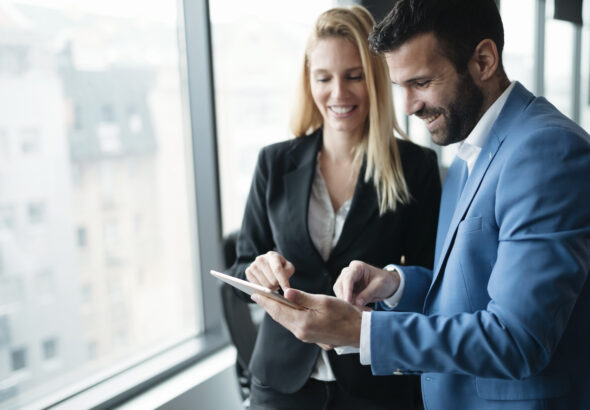 Happy business colleagues in modern office