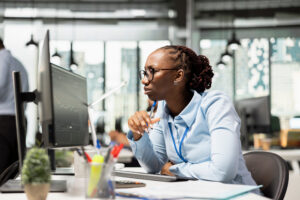 Brokerage company portfolio manager reviews asset performance