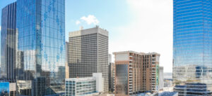 Panorama aerial view of downtown Dallas, Texas during sunny autumn day with colorful fall foliages