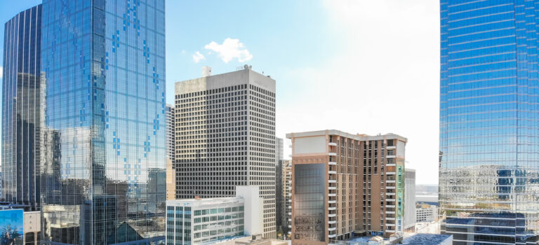 Panorama aerial view of downtown Dallas, Texas during sunny autumn day with colorful fall foliages
